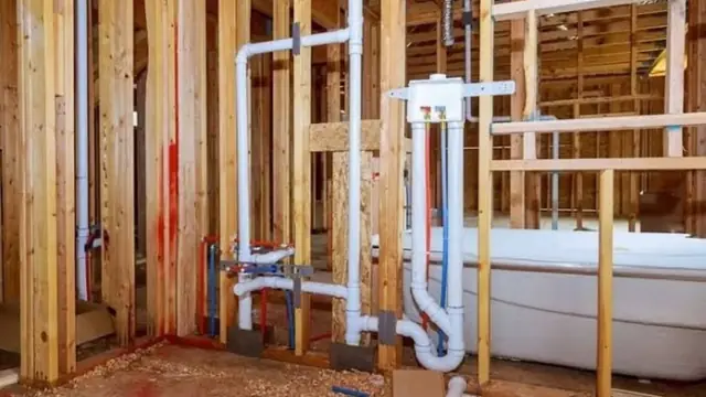 Framed bathroom wall with drain and supply rough-in plumbing